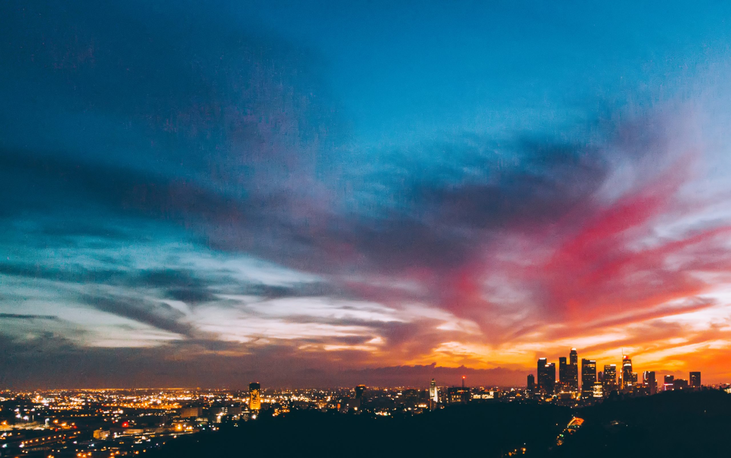 Illuminated city in sunset time