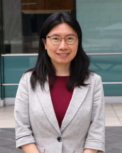 Staff photo of Dr. Dan Wei in front of a non-descript background